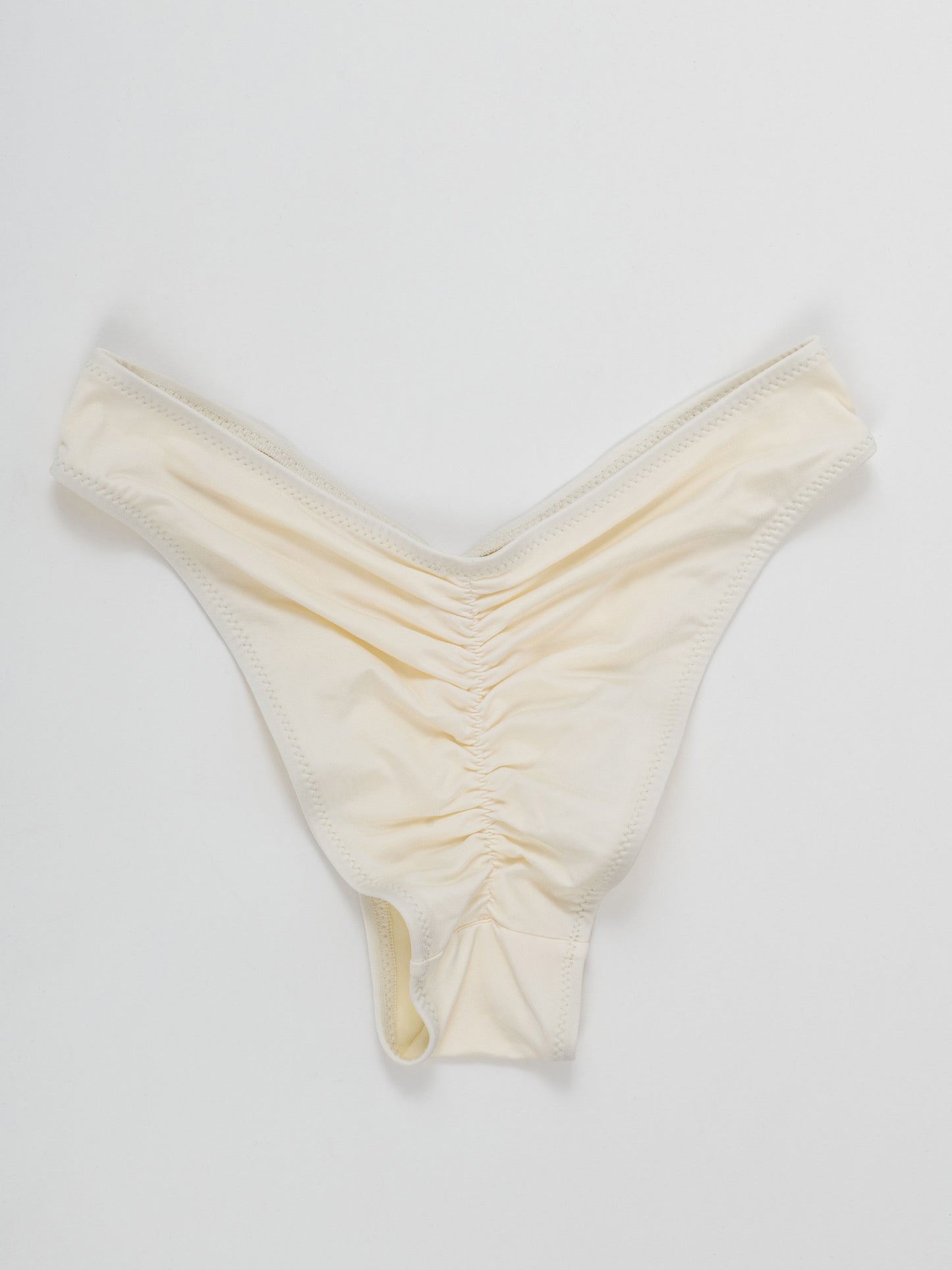 White pole dance shorts with ruched back detail on white background