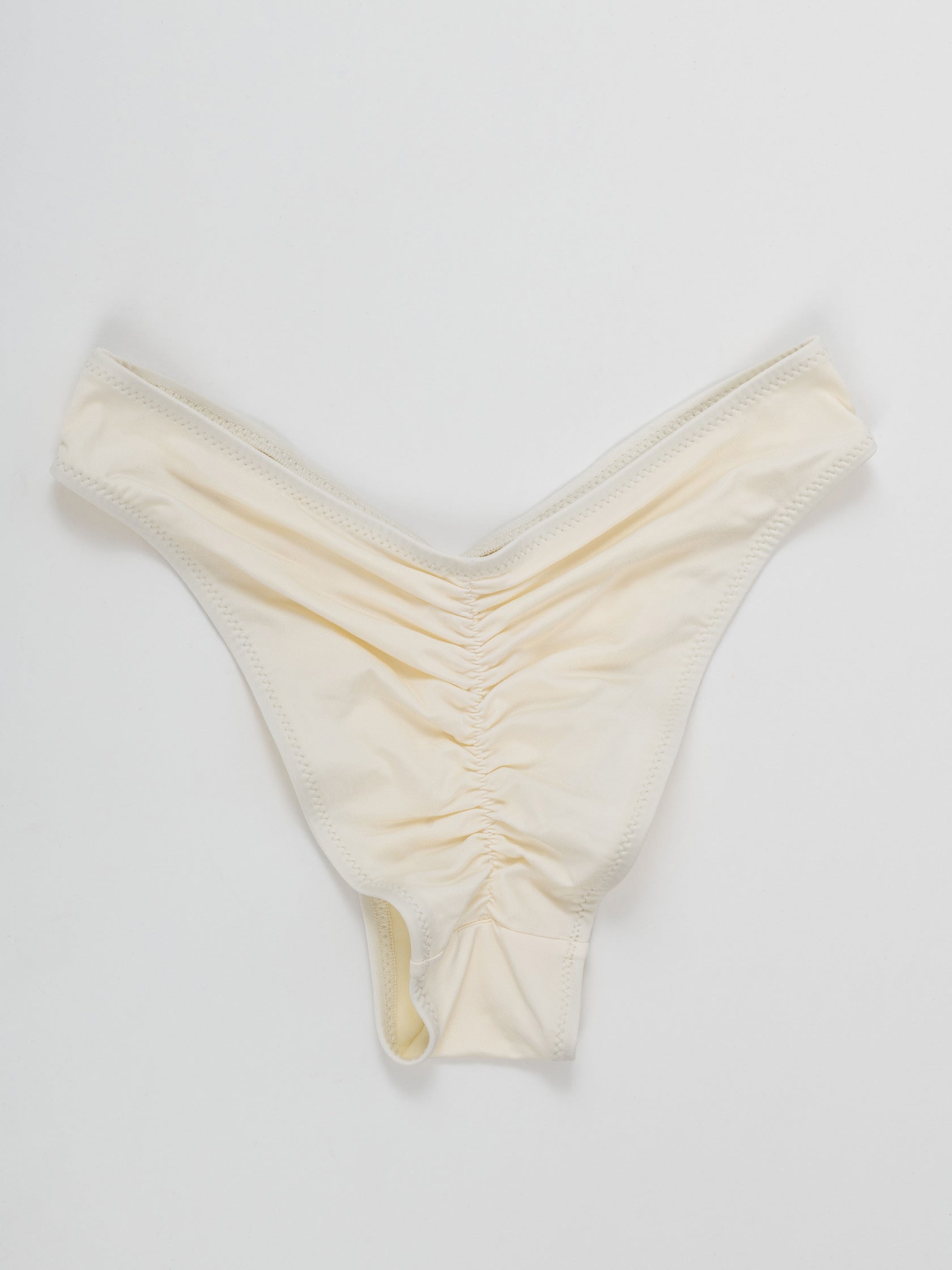 White pole dance shorts with ruched back detail on white background