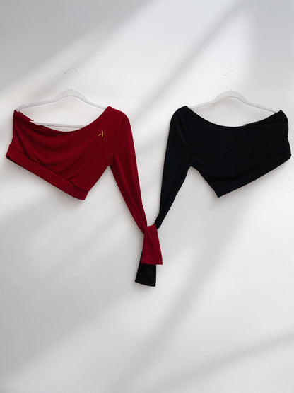 Due top monospalla da pole dance in jersey colori rosso e nero